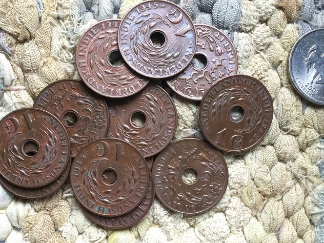 kenapa kebanyakan syiling kuno mempunyai lubang 1