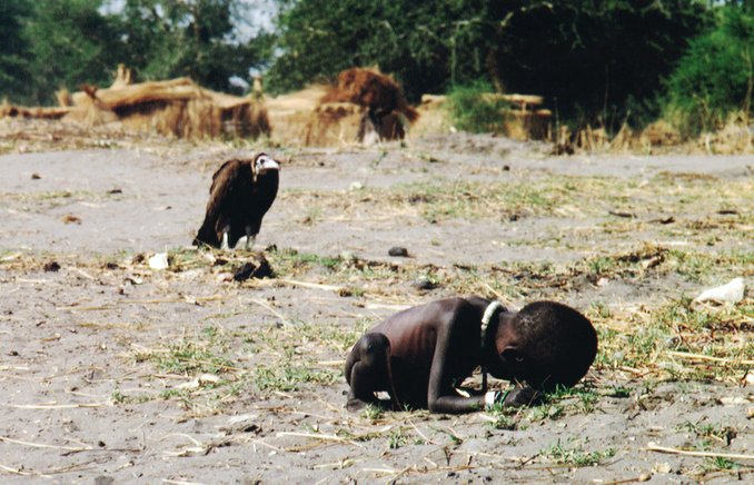 starving child and vulture
